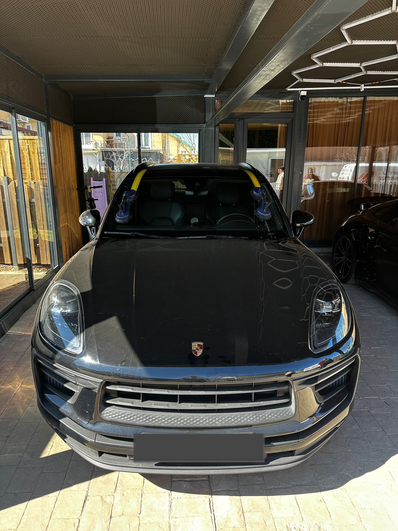 Porsche Macan — windshield, under canopy