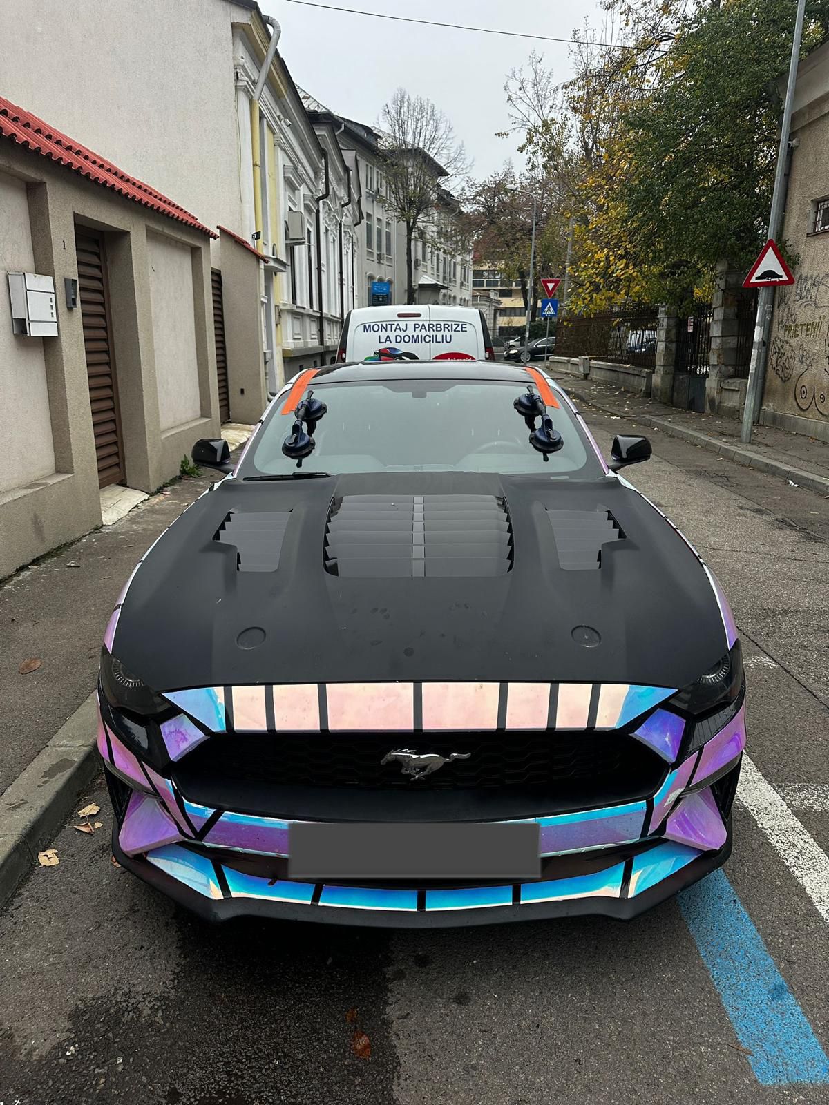 Ford Mustang — windshield, next to APB van